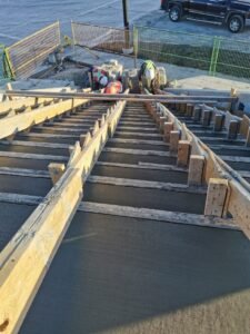 Concrete stairs under construction with wooden formwork, built by Vancal Concrete LTD in Calgary, Alberta.